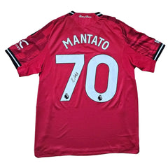 Back view featuring Mantato, No. 70, with a visible black signature on the shirt.