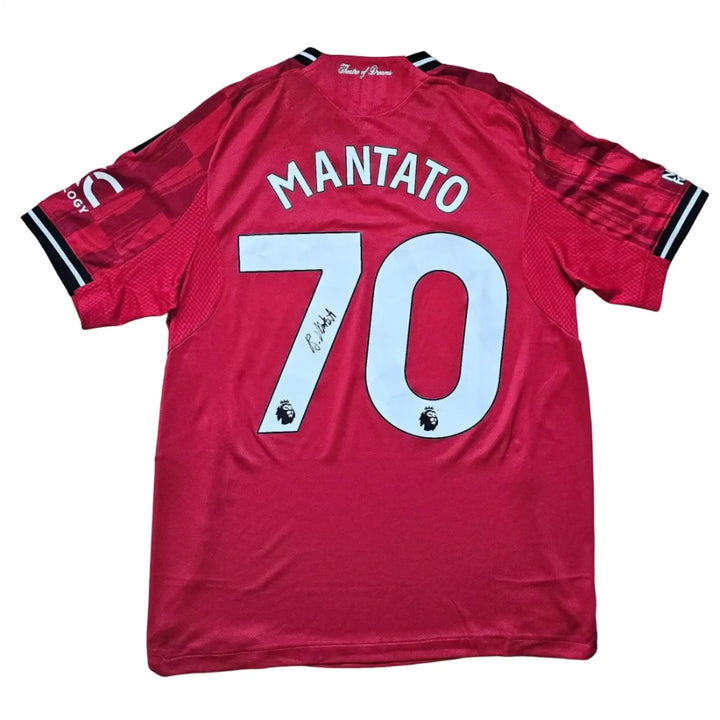 Back view featuring Mantato, No. 70, with a visible black signature on the shirt.