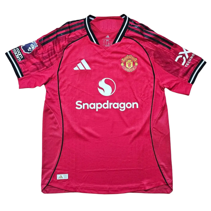 Back view showcasing the Manchester United crest, SnapDragon logo, and red design details.