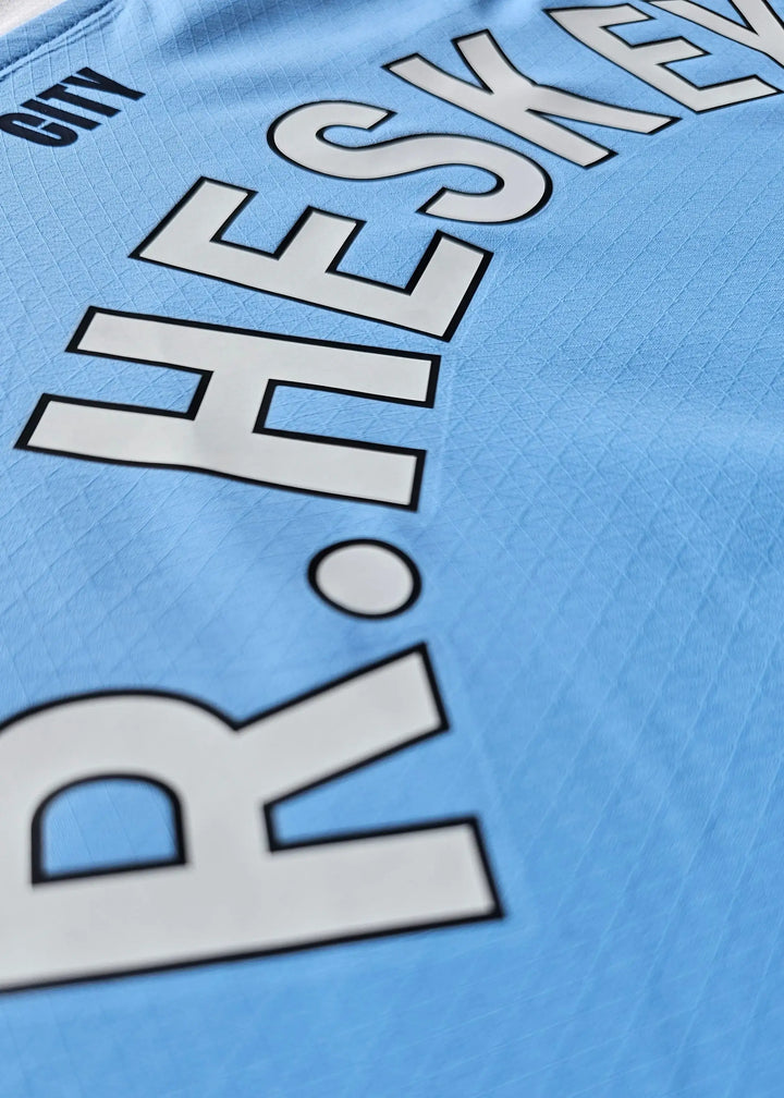 Back view displaying name HESKEY and CITY above in large letters.
