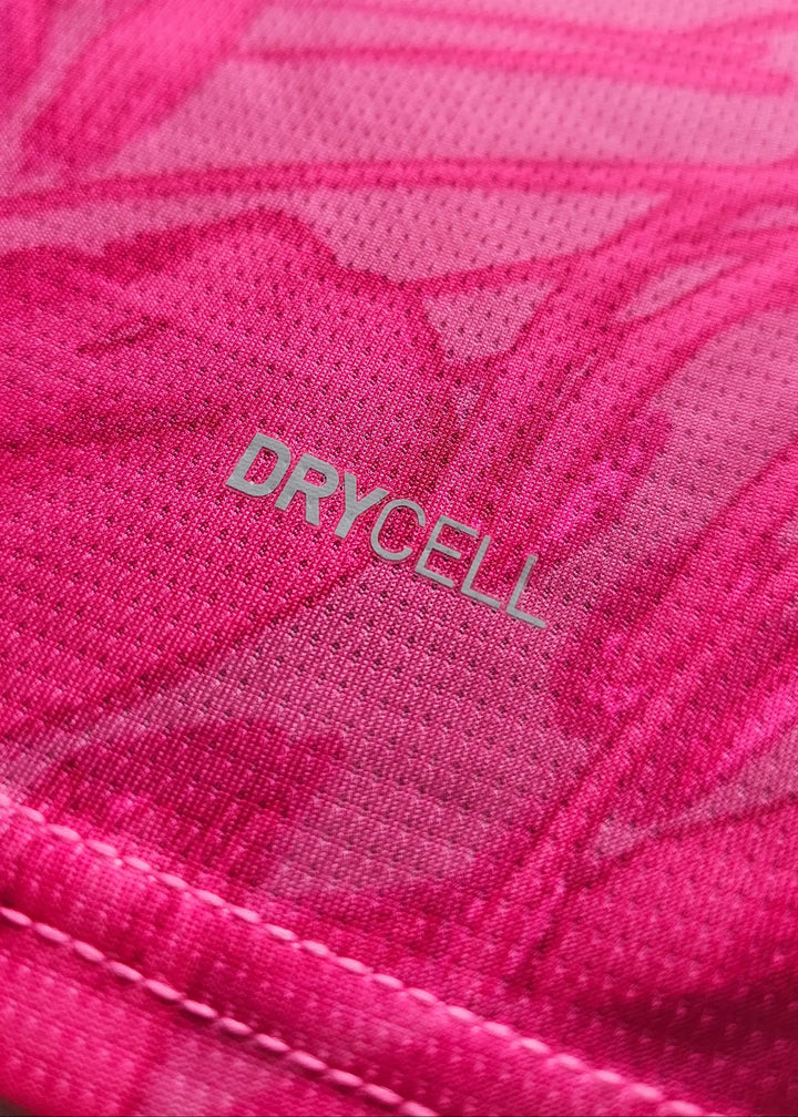 Close-up of the pink fabric featuring the word 'DRYCELL' on the signed football shirt.