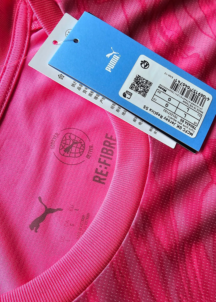 Detail view featuring pink fabric, Puma logo, and RE:FIBRE text on the collar area.