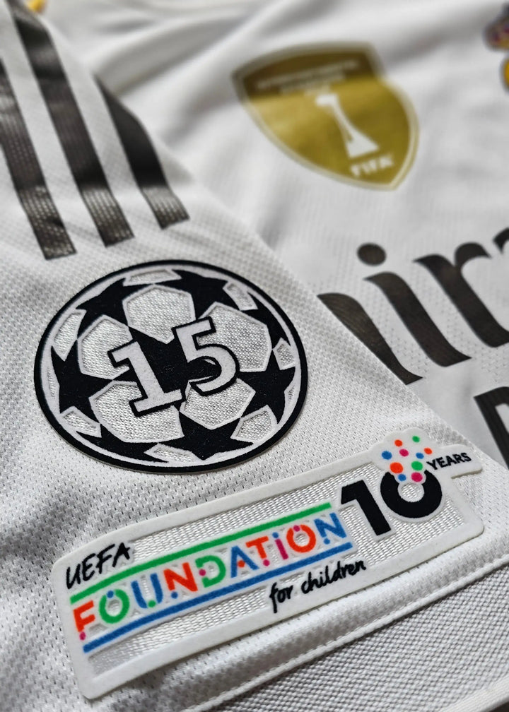 Close-up view showing UEFA Champions League patch with '15' and UEFA Foundation 10 Years label.
