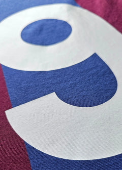Close-up view of the No. 9 and signature detail on the signed Johan Cruyff Barcelona shirt.