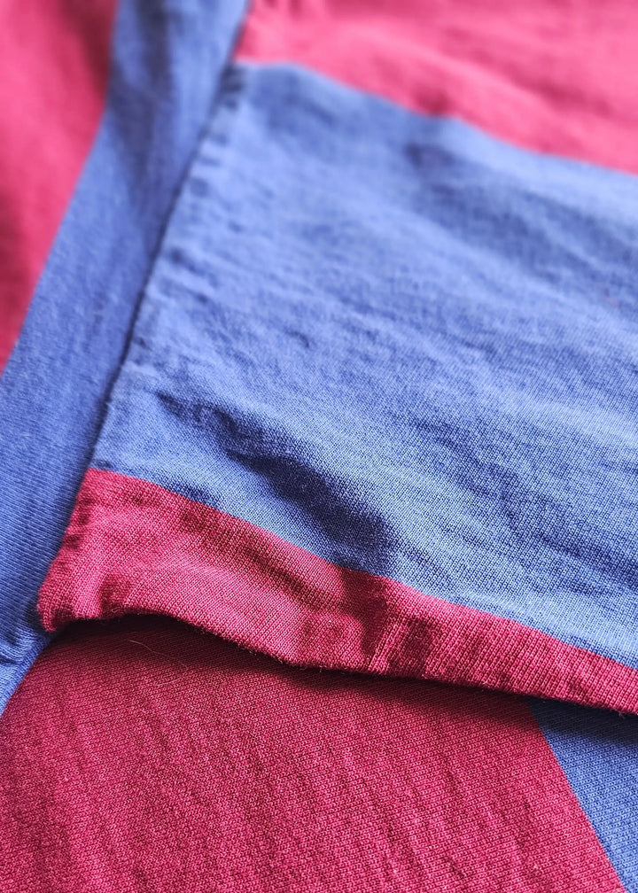 Close-up view of the signed Johan Cruyff No. 9 Barcelona football shirt with red and navy colors.