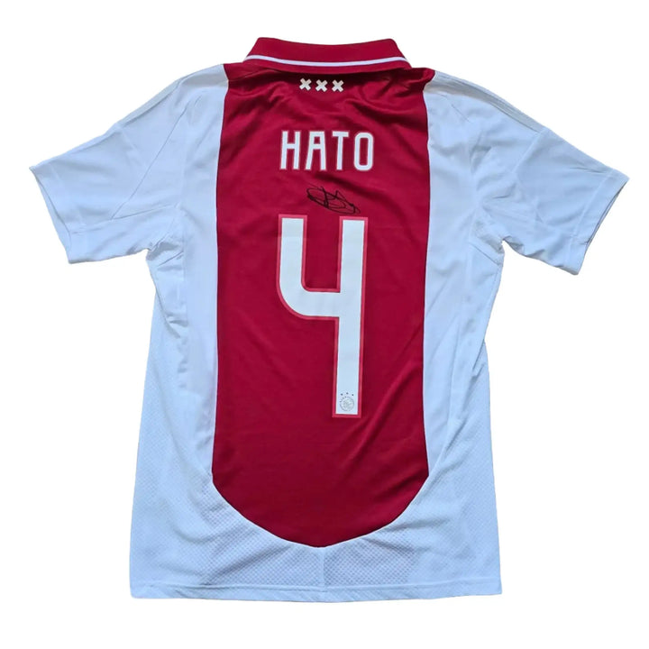 Back view showing No. 4, Hato, and a visible signature on an AFC Ajax football shirt.