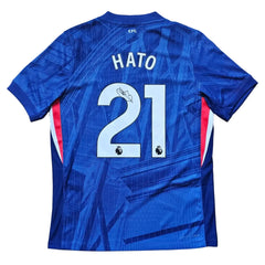 Back view showing HATO and No. 21 on a blue football shirt with the Premier League logo.