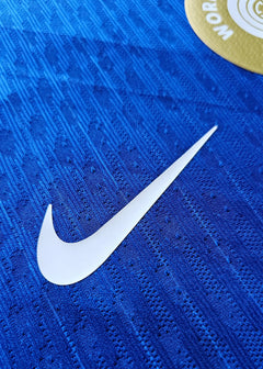 Detail of the blue fabric with a visible Nike swoosh on the signed Chelsea football shirt.