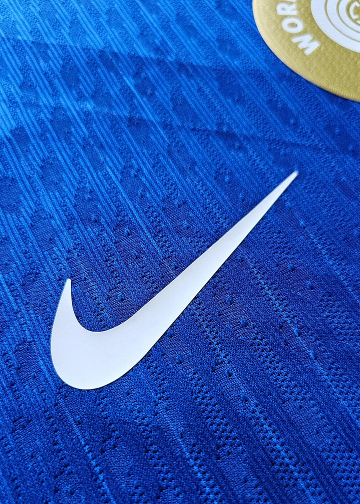 Detail of the blue fabric with a visible Nike swoosh on the signed Chelsea football shirt.