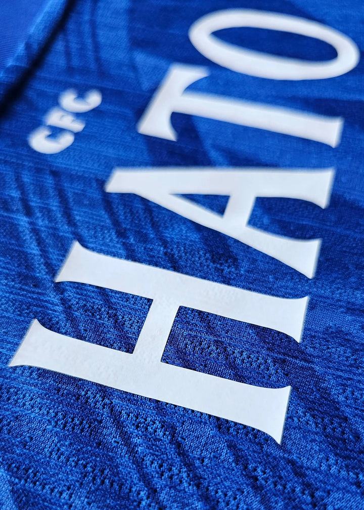 Close-up showing the name HATO and CFC printed on a blue background.