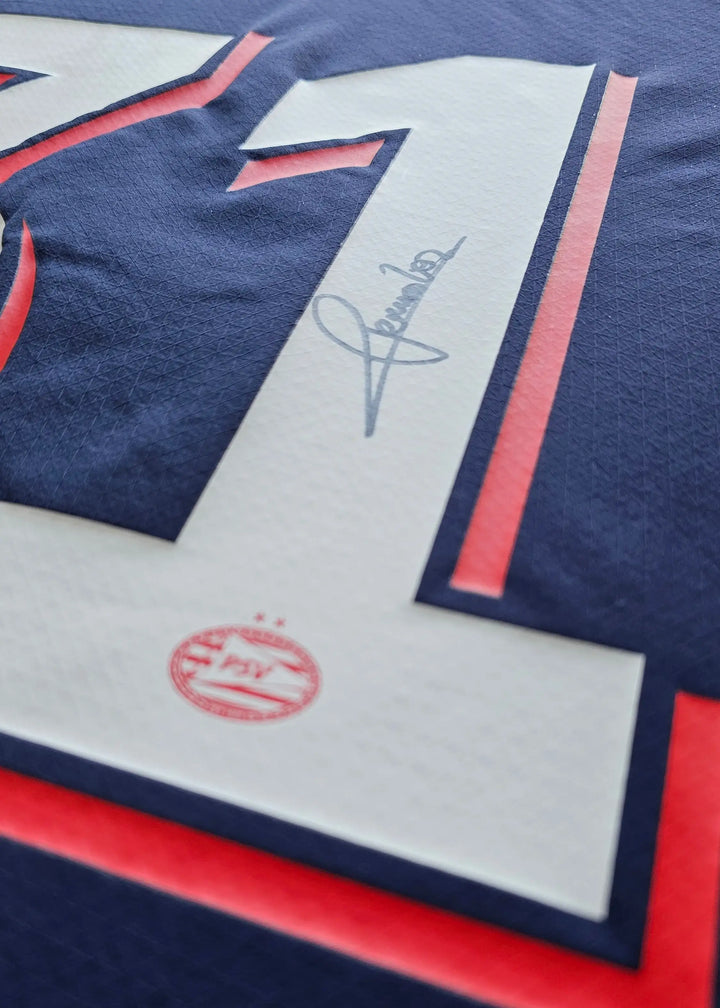 Close-up showing No. 31, player signature, and PSV emblem with two stars.