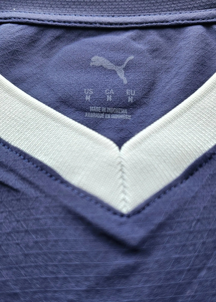 Label detail showing PUMA branding and size information: US M, CA M, EU M.