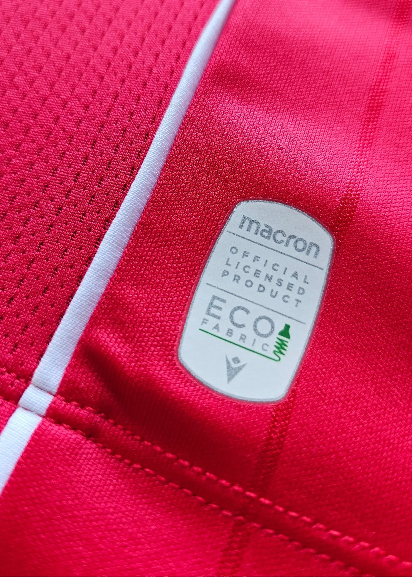 Detail view highlighting the official Macron label, indicating licensed product and ECO fabric.