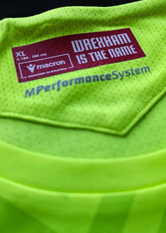 Size label showing 'WREXHAM IS THE NAME', 'XL', and 'macron' branding in bright green.