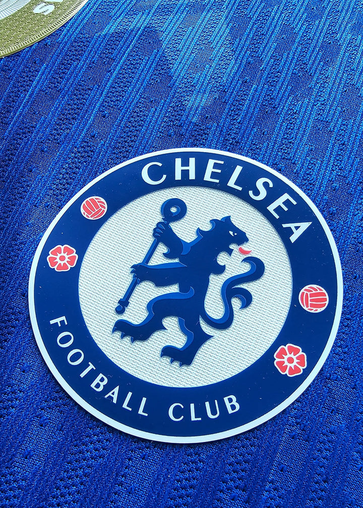 Close-up of Chelsea F.C. crest with lion emblem and text 'CHELSEA FOOTBALL CLUB'.
