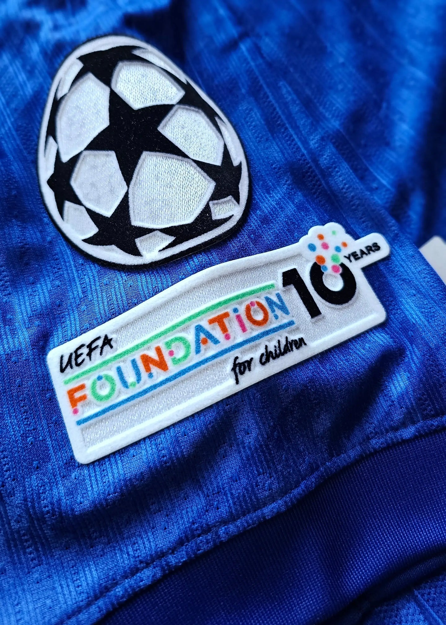 Detail showing UEFA Foundation for children logo and decorative soccer ball design.