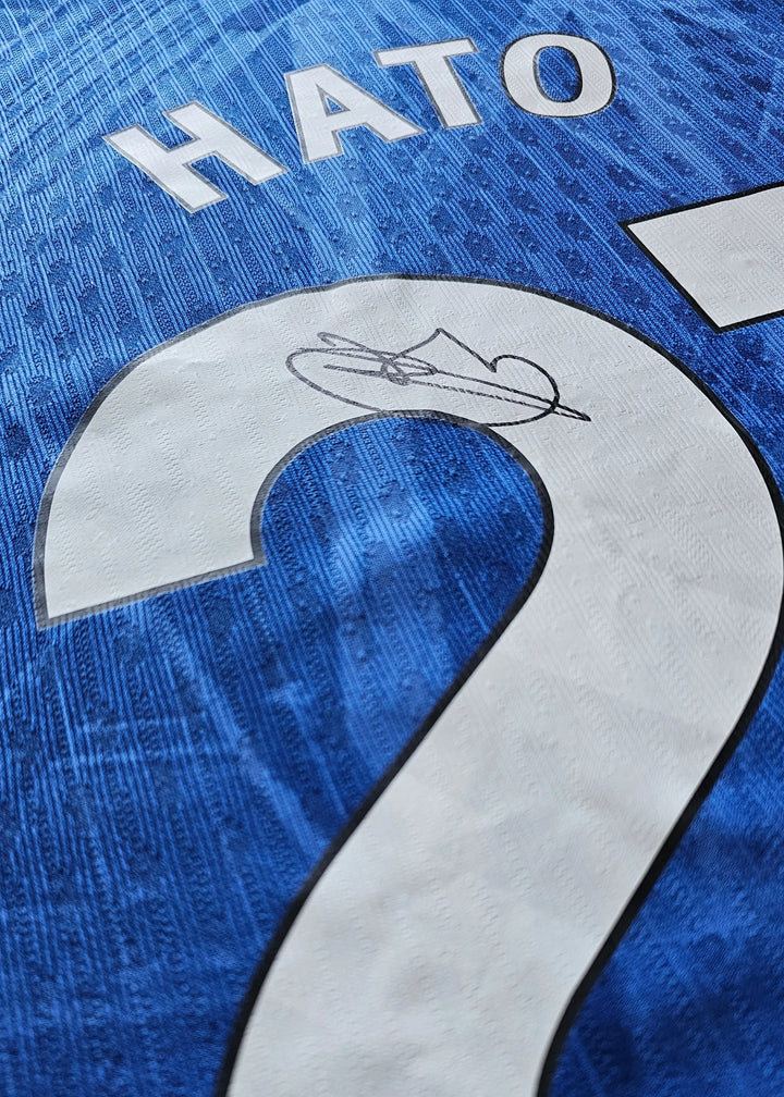 Close-up of shirt showing name HATO and No. 21 with a visible signature detail.