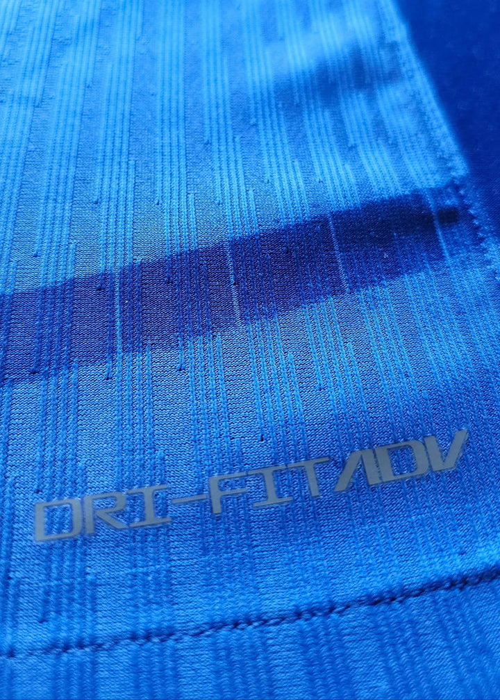 Close-up detail showing the DRI-FIT ADV text on the blue fabric.