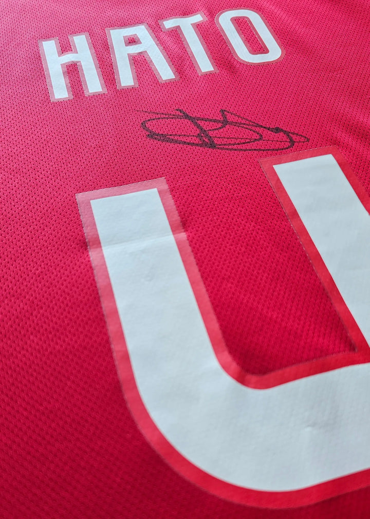 Back view displaying name 'HATO', squad number '4', and a visible signature.