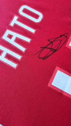 Close-up of the signed name 'Hato' and No. 4 on a red football shirt from AFC Ajax.