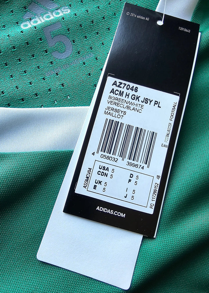Close-up of the size tag showing size 5 and care instructions on a green soccer jersey with No. 5.