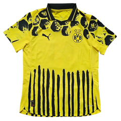 Back view showing Borussia Dortmund crest with two stars and black striped design.