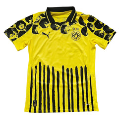 Back view showing BVB crest, two stars, and black stripe pattern on yellow shirt.