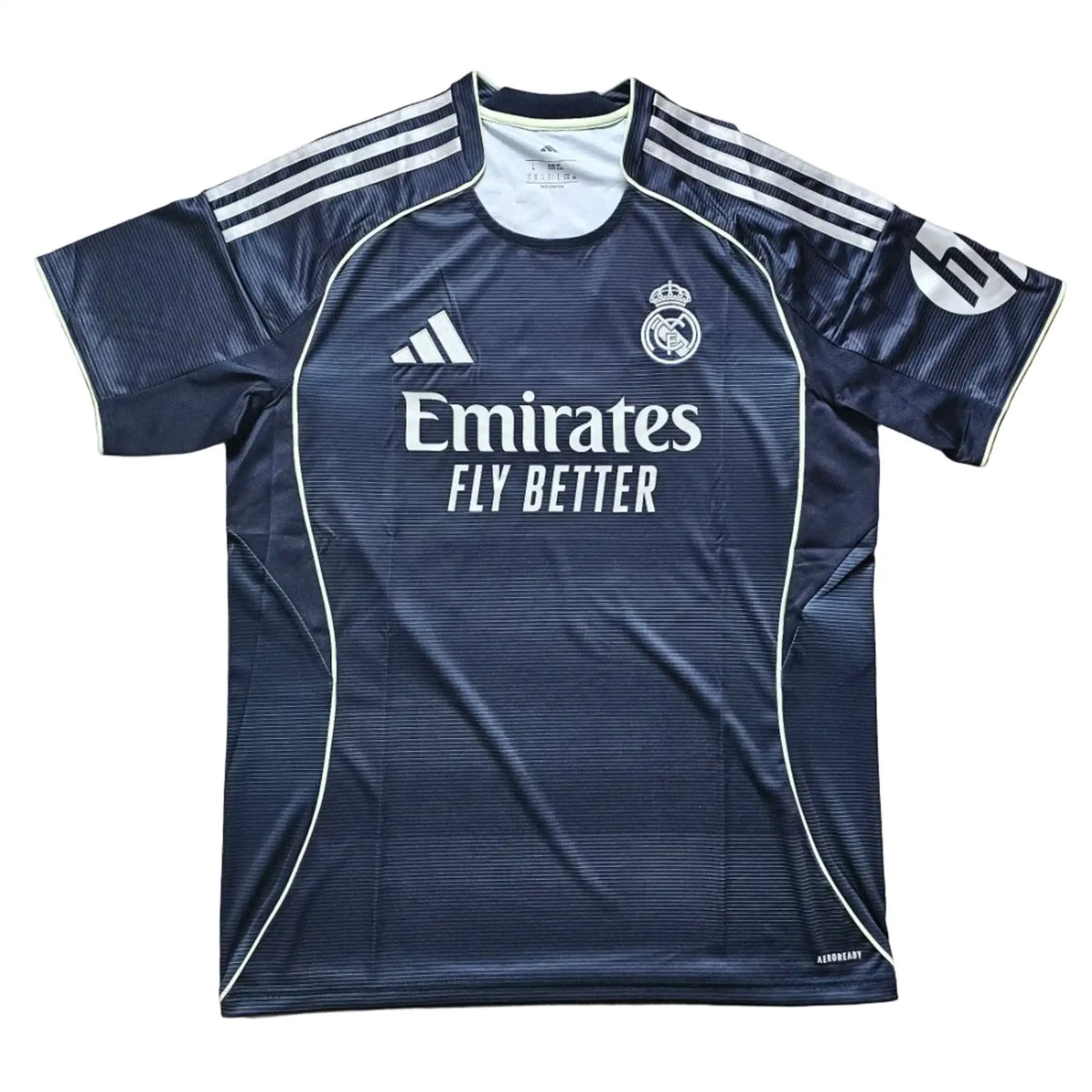 Back view featuring Real Madrid crest, Emirates sponsor text, and Dean Huijsen No. 24.