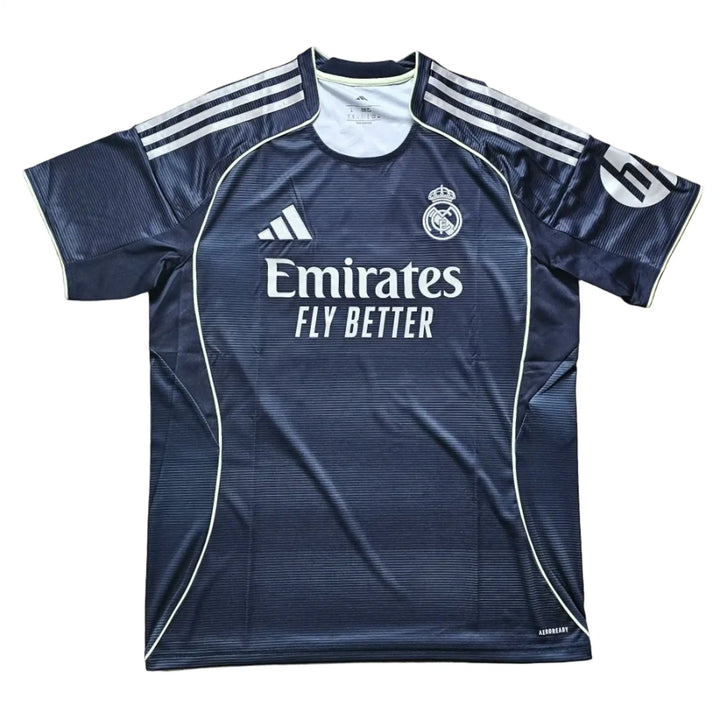 Back view featuring Real Madrid crest, Emirates sponsor text, and Dean Huijsen No. 24.