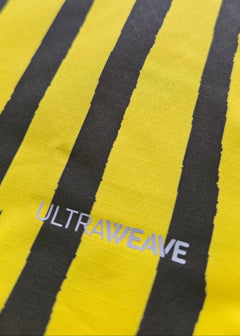 Close-up of yellow and black stripes with visible ULTRAWEAVE detail.
