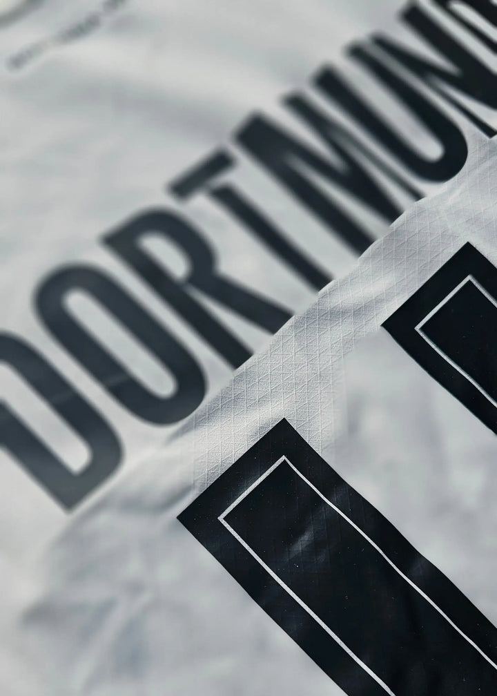 Detail view of Borussia Dortmund with No. 11 on the football shirt.