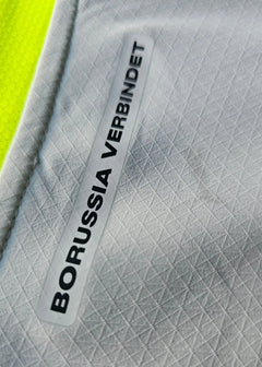 Crest detail showing 'BORUSSIA VERBINDET' on a light gray background.