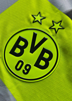 Crest detail featuring Borussia Dortmund logo with two stars above BVB 09 in vibrant yellow.