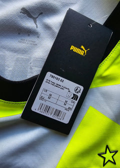 Tag showing BVB Away Jersey Authentic, size M with Puma logo and yellow detail.