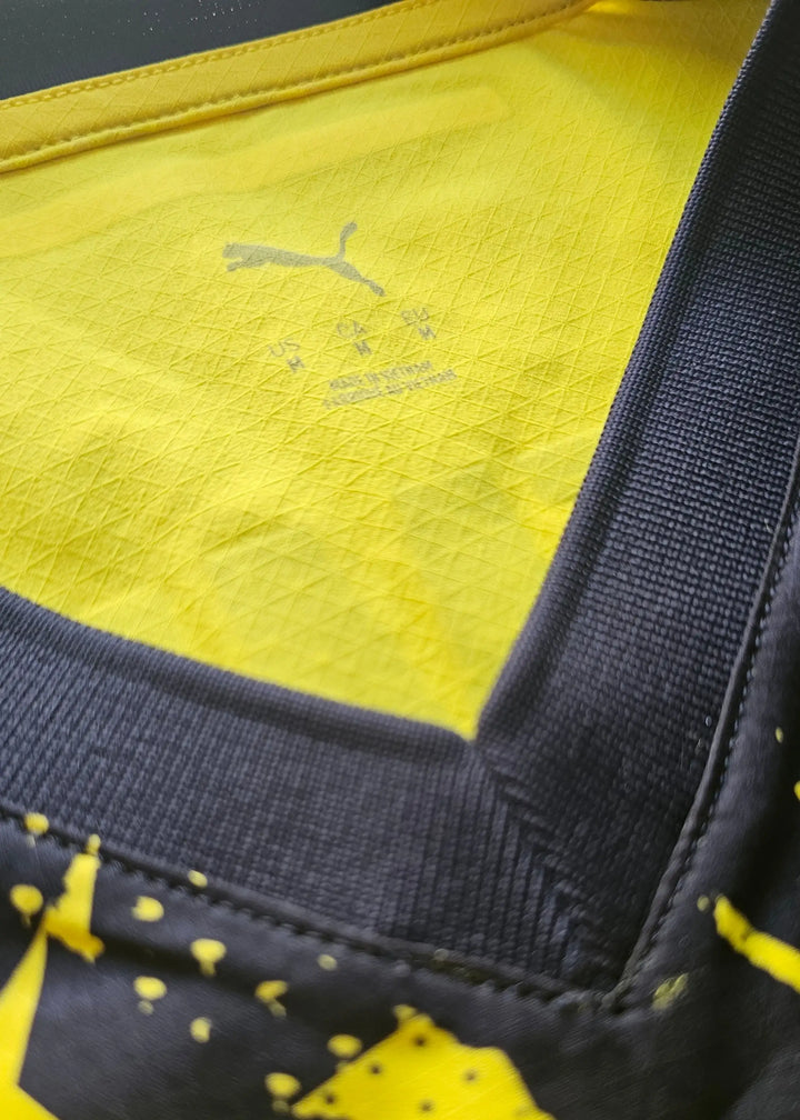 Close-up view of the collar and care label showing Puma logo and size details.