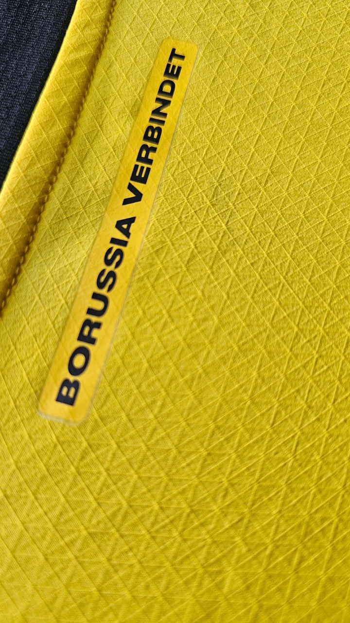 Close-up of yellow fabric with &