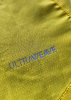 Close-up showing the textured yellow fabric with 'ULTRAWEAVE' branding in blue.