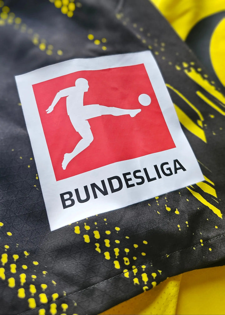 Close-up of the Borussia Dortmund crest detail featuring the Bundesliga logo.