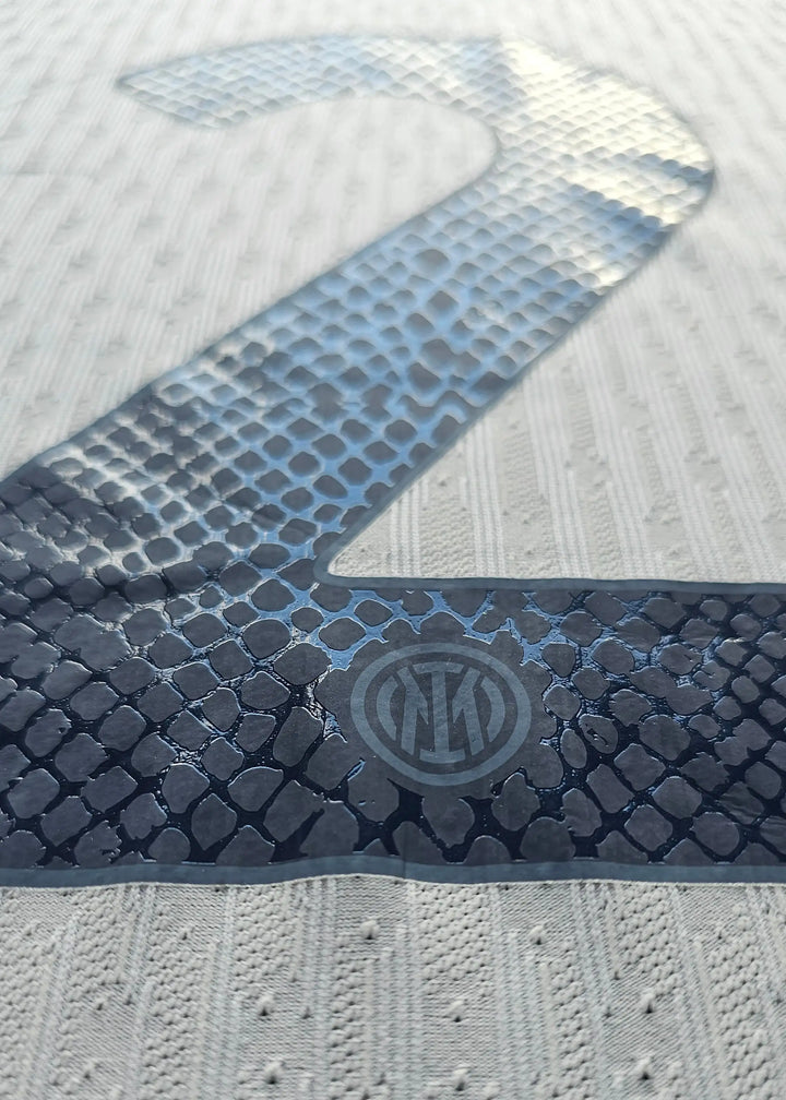 Close-up of the No. 2 with Inter Milan crest visible underneath.
