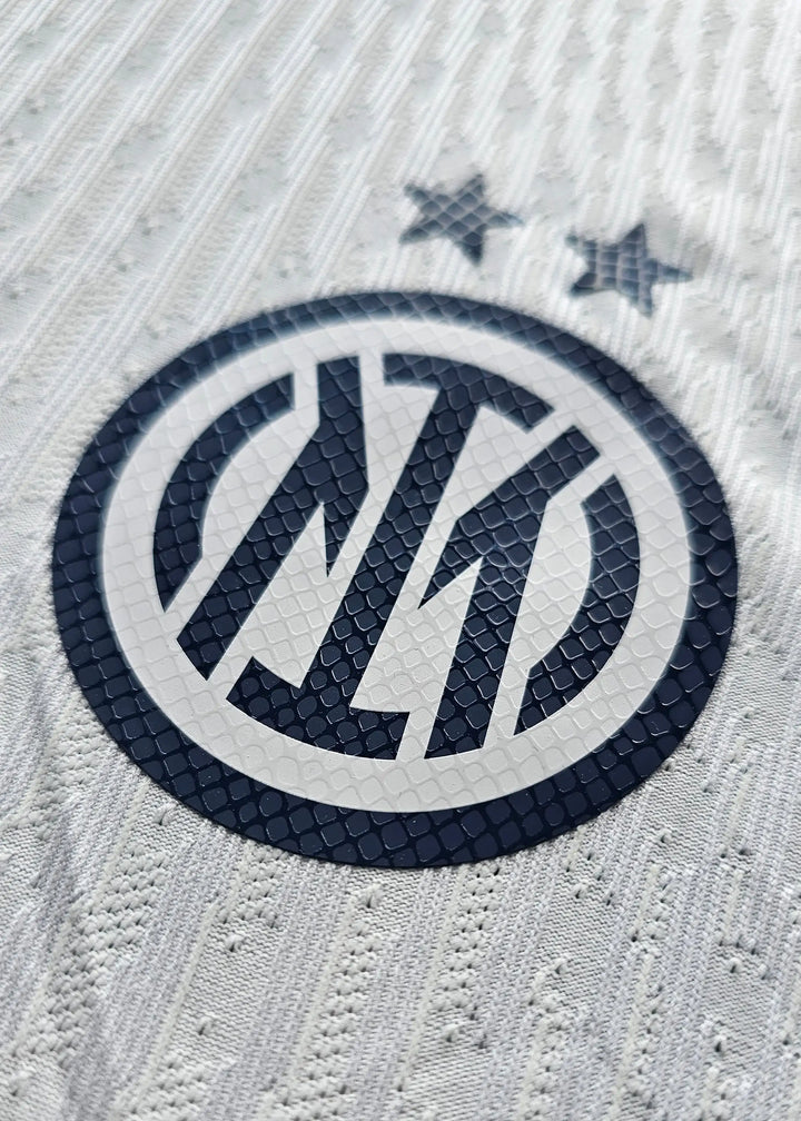 Close-up of the Inter Milan crest with two stars above, featuring blue details on a white background.