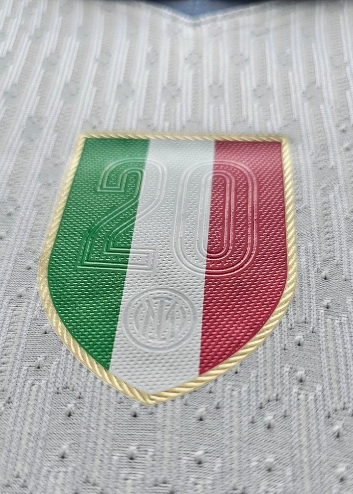Close-up of Inter Milan crest featuring green, white, and red stripes with No. 20.