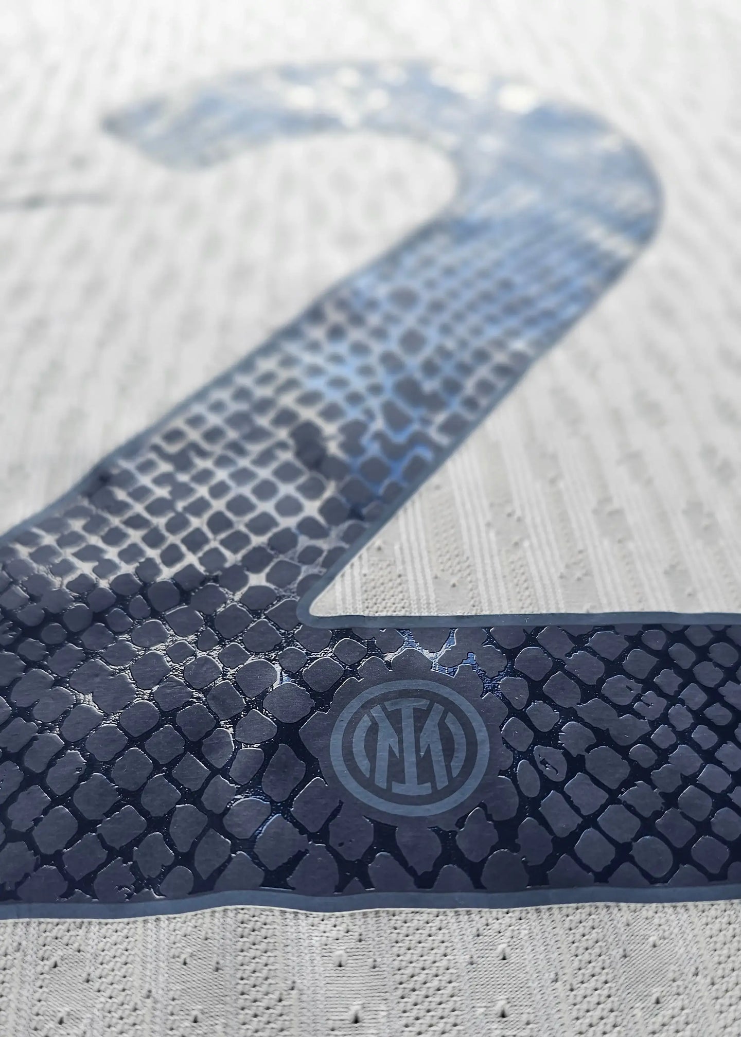 Detail showing No. 2 in navy, with Inter Milan crest visible in the lower right corner.