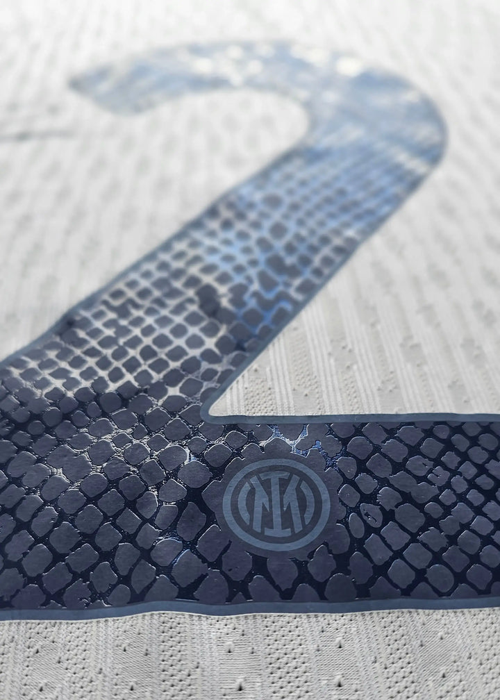 Detail showing No. 2 in navy, with Inter Milan crest visible in the lower right corner.