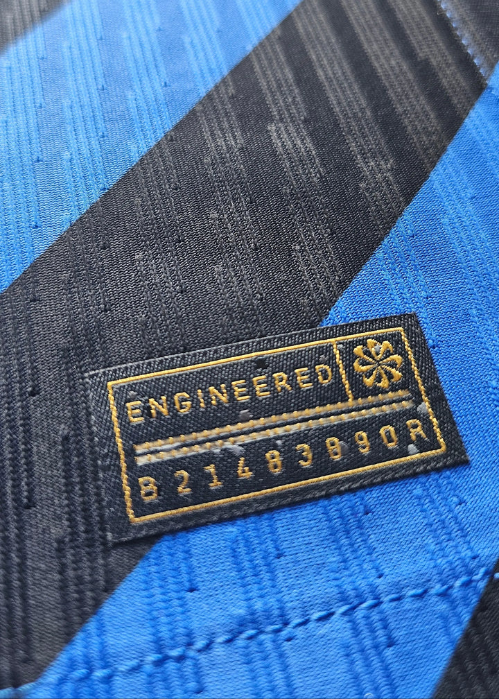 Close-up view of the tag displaying 'ENGINEERED' and the number '82148390R'.