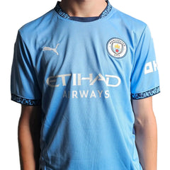 Front view displaying Manchester City crest, ETIHAD AIRWAYS sponsor, and PUMA branding.
