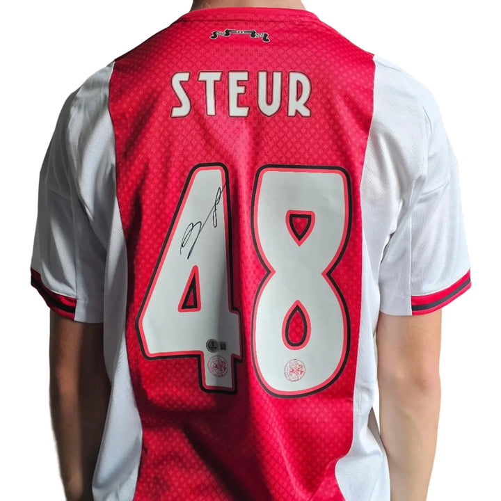 Back view showing player name Steur, No. 48, and a visible signature.