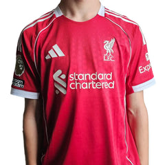 Back view showing Liverpool crest, standard chartered sponsor, and adidas logo in red.