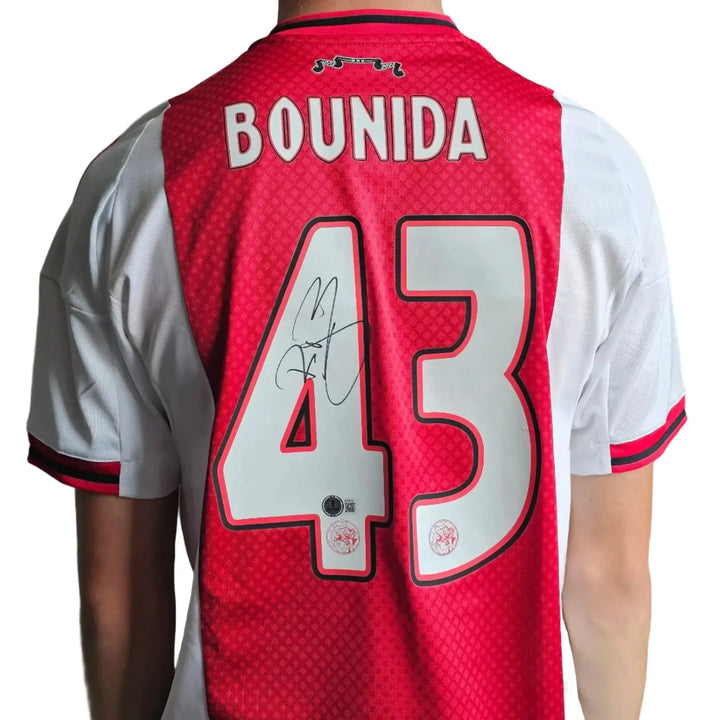 Back view displaying Bounida, No. 43, with a visible signature on the red and white design.