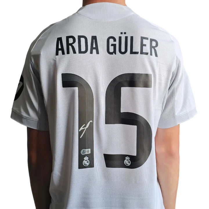 Back view showing Arda Güler's name, No. 15, and a visible signature.