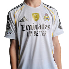 Back view highlighting the Real Madrid crest, Emirates sponsor, and FIFA badge.